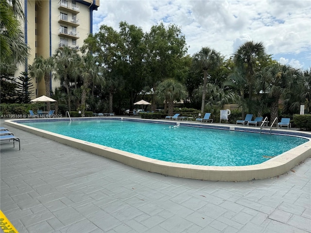 pool with a patio area
