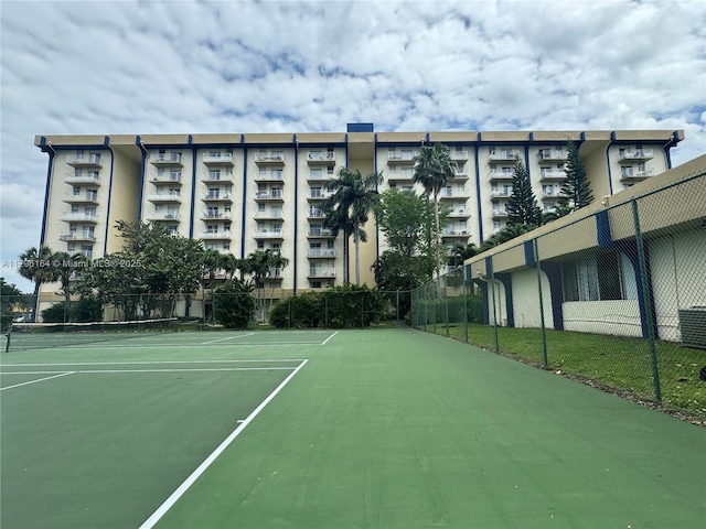 view of sport court featuring fence