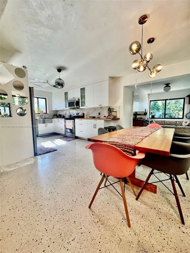 dining area featuring a notable chandelier
