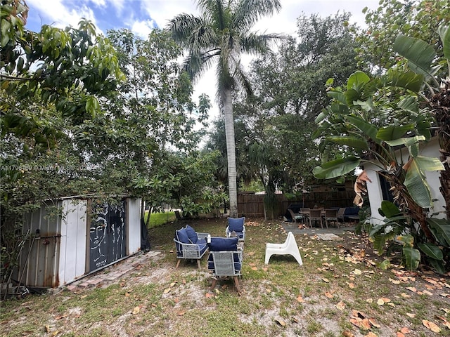 722 SW 10th St, Hallandale Beach, FL 33009 - view of yard with a storage shed and a patio area