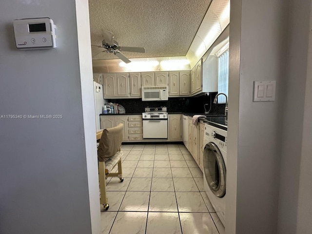 kitchen featuring ceiling fan, dark countertops, tasteful backsplash, washer / dryer, and white appliances