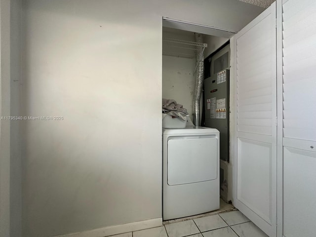 washroom featuring laundry area, washer / dryer, and water heater