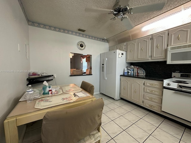 kitchen with visible vents, white appliances, a textured ceiling, a ceiling fan, and light tile patterned floors