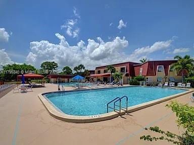pool with a patio area