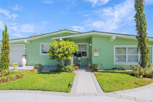 7691 NW 15th Ct, Pembroke Pines, FL 33024 - view of front of home with stucco siding and a front yard
