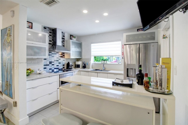 7691 NW 15th Ct, Pembroke Pines, FL 33024 - kitchen with a sink, wall oven, stainless steel fridge, wall chimney range hood, and recessed lighting