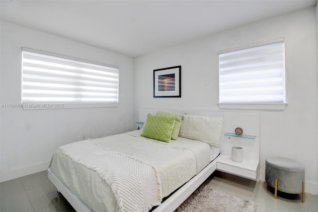 7691 NW 15th Ct, Pembroke Pines, FL 33024 - tiled bedroom with baseboards
