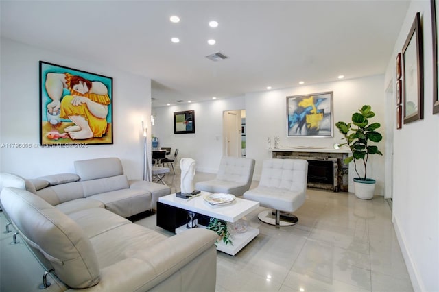 7691 NW 15th Ct, Pembroke Pines, FL 33024 - living area featuring baseboards, recessed lighting, and a stone fireplace