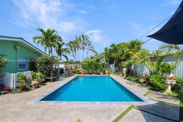 7691 NW 15th Ct, Pembroke Pines, FL 33024 - view of swimming pool with a fenced backyard and a patio