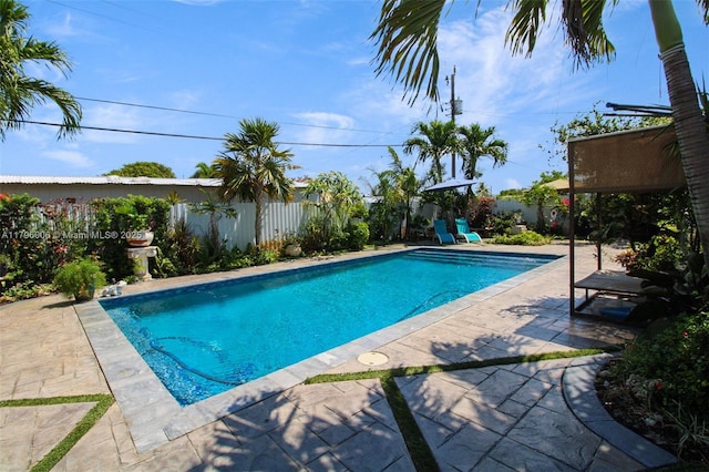7691 NW 15th Ct, Pembroke Pines, FL 33024 - view of swimming pool with a patio and a fenced backyard