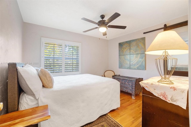 bedroom featuring ceiling fan and light wood-type flooring