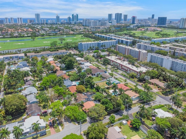 aerial view with a view of city, a water view, and golf course view