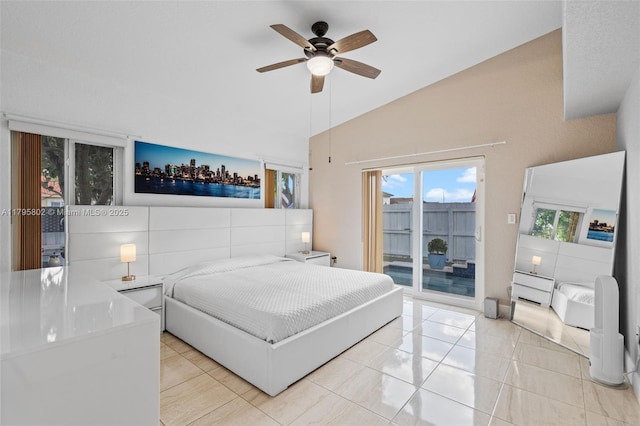 bedroom with ceiling fan, light tile patterned floors, vaulted ceiling, and access to exterior