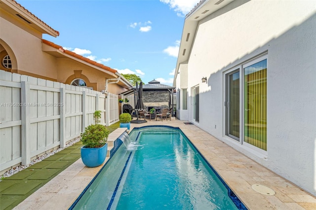 view of pool with a patio, a gazebo, a fenced in pool, and fence private yard