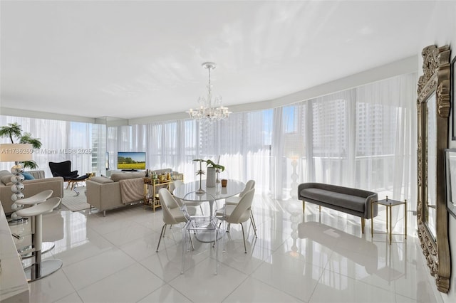 dining area with light tile patterned floors and a notable chandelier