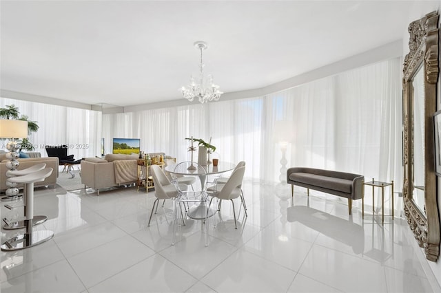 dining area with a chandelier and light tile patterned floors
