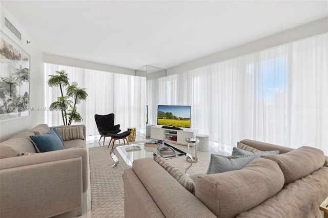 living room featuring visible vents and a wealth of natural light