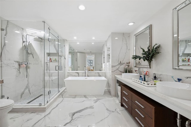 bathroom with recessed lighting, a freestanding tub, tile walls, and a marble finish shower