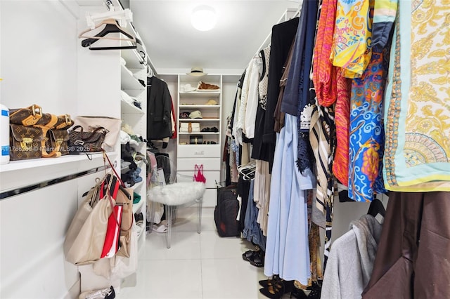 spacious closet featuring tile patterned floors