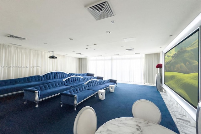 living area featuring a healthy amount of sunlight, carpet floors, and visible vents