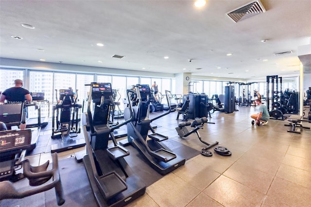 workout area featuring recessed lighting and visible vents