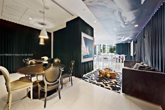 dining space with tile patterned floors and recessed lighting