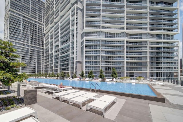 community pool with a patio area