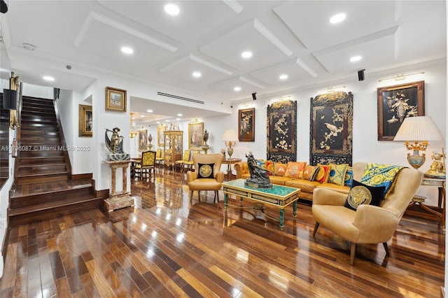 living room with stairs, beamed ceiling, coffered ceiling, recessed lighting, and hardwood / wood-style floors