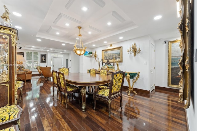 dining space with baseboards, recessed lighting, a raised ceiling, and wood-type flooring
