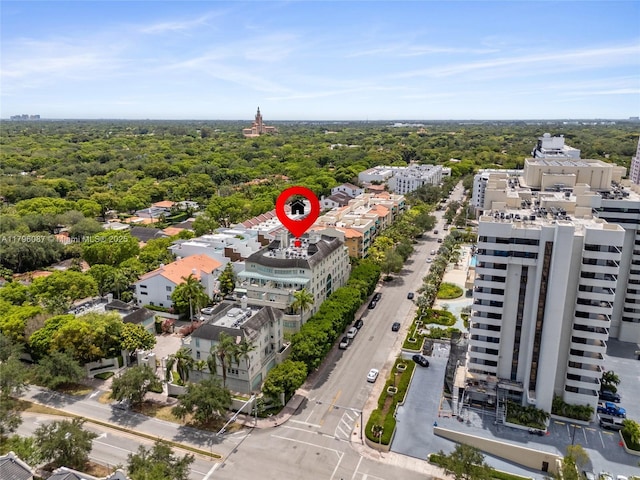 drone / aerial view featuring a view of trees