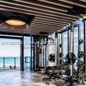 exercise room featuring a wall of windows