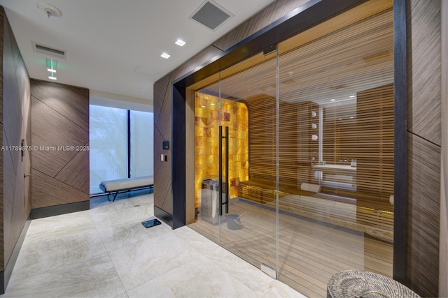 hall featuring visible vents