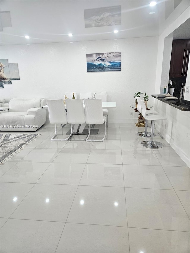 living room featuring recessed lighting and baseboards