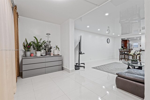 301 NE 14th Ave Unit 207, Hallandale Beach, FL 33009 - living room featuring tile patterned floors, recessed lighting, and baseboards