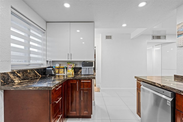 301 NE 14th Ave Unit 207, Hallandale Beach, FL 33009 - kitchen featuring dishwasher, dark stone countertops, light tile patterned flooring, recessed lighting, and a textured ceiling