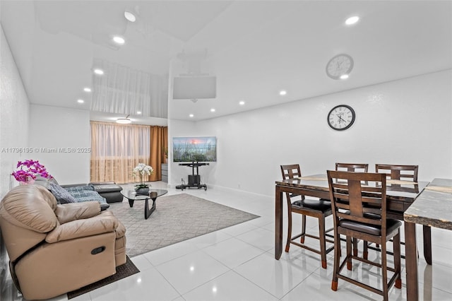 301 NE 14th Ave Unit 207, Hallandale Beach, FL 33009 - living area featuring light tile patterned flooring, recessed lighting, and a high ceiling