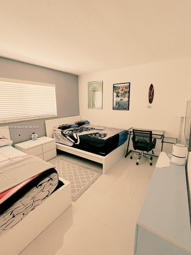 bedroom featuring a textured ceiling
