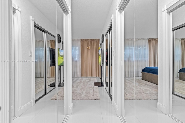 301 NE 14th Ave Unit 207, Hallandale Beach, FL 33009 - corridor with tile patterned flooring