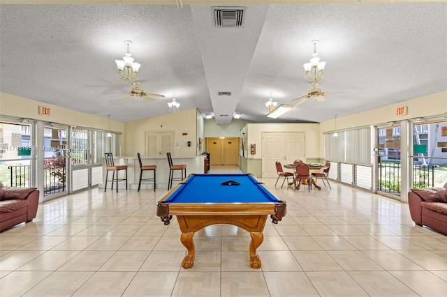 301 NE 14th Ave Unit 207, Hallandale Beach, FL 33009 - recreation room featuring a chandelier, a ceiling fan, vaulted ceiling, a textured ceiling, and billiards table