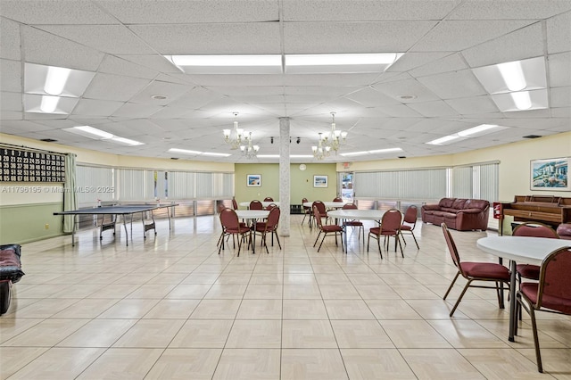 301 NE 14th Ave Unit 207, Hallandale Beach, FL 33009 - dining room with a chandelier and a paneled ceiling