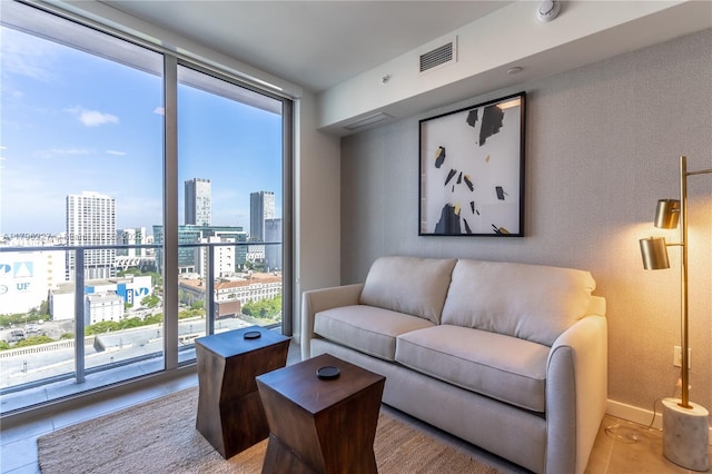 tiled living area with a view of city and visible vents