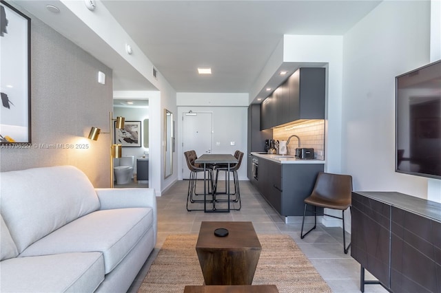 living room featuring light tile patterned flooring and visible vents