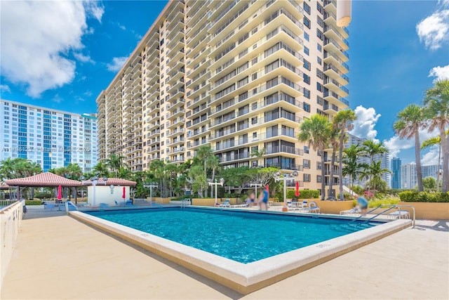 community pool with a gazebo