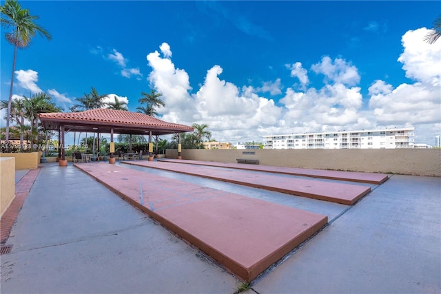 view of community featuring fence