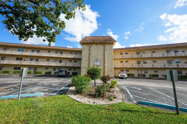 view of property with uncovered parking