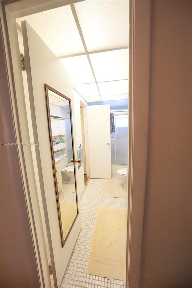 hallway featuring tile patterned flooring