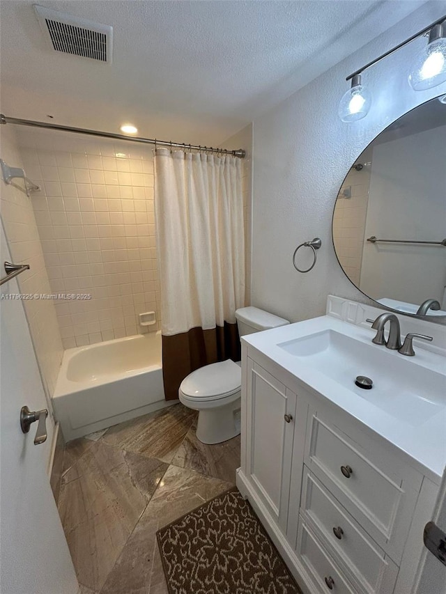 850 SW 133rd Ter Unit 312B, Pembroke Pines, FL 33027 - bathroom with vanity, toilet, shower / tub combo with curtain, and a textured ceiling
