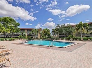 community pool featuring a patio area