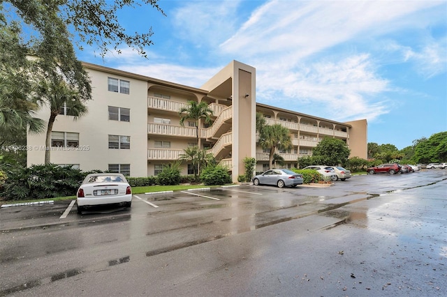 view of property with uncovered parking