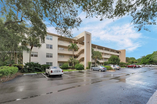 view of property with uncovered parking